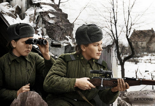 Photo of Roza and unknown spotter, posing for the camera in active sniping positions